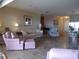 Cozy living room featuring neutral tones, tile flooring, and comfortable seating arrangement at 4555 Bay Club Dr # 22, Bradenton, FL 34210