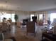 Open concept living and dining area, tile floors, fireplace, patio access, and comfortable seating at 4555 Bay Club Dr # 22, Bradenton, FL 34210