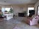 Relaxing living room with a fireplace, tile flooring, and comfortable seating arrangement at 4555 Bay Club Dr # 22, Bradenton, FL 34210