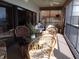 Relaxing outdoor patio with comfortable seating, a ceiling fan, and sliding glass doors for natural light at 4555 Bay Club Dr # 22, Bradenton, FL 34210