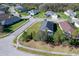 Overhead view of the home with a large backyard, screened-in patio, and mature trees at 4706 Roycroft Ter, Parrish, FL 34219