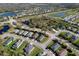 Aerial view showing homes with well manicured lawns and ponds throughout the community at 4706 Roycroft Ter, Parrish, FL 34219