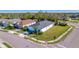 Beautiful corner-lot home featuring a well-manicured lawn and tropical landscaping at 4706 Roycroft Ter, Parrish, FL 34219