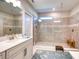 Bathroom featuring tiled walk-in shower and a gray vanity with countertop at 4706 Roycroft Ter, Parrish, FL 34219