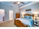 Comfortable bedroom with wood furniture, ceiling fan, and a closet at 4706 Roycroft Ter, Parrish, FL 34219