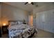 Comfortable bedroom with carpet flooring, a queen bed, and a closet with double doors at 4706 Roycroft Ter, Parrish, FL 34219