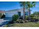 Charming single-Gathering home featuring a two-car garage, neat landscaping, and well-placed palm trees at 4706 Roycroft Ter, Parrish, FL 34219