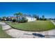 Charming single Gathering home with lush lawn, sidewalk and mature landscaping at 4706 Roycroft Ter, Parrish, FL 34219