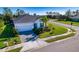 Well-maintained single-story home with a two-car garage, manicured lawn, and tasteful landscaping at 4706 Roycroft Ter, Parrish, FL 34219