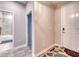 Entryway featuring gray tone color palette, wood-look floors and bathroom access at 4706 Roycroft Ter, Parrish, FL 34219