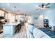 Open living space with a view of the kitchen and connected rooms at 4706 Roycroft Ter, Parrish, FL 34219