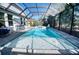 Large, screened pool with integrated spa and ample deck space for entertaining at 4706 Roycroft Ter, Parrish, FL 34219