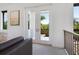 Bright room featuring French doors opening to a private balcony with lush views at 4940 Peaceable Way, Sarasota, FL 34242