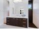 Contemporary bathroom features a sleek vanity, decorative bowl, and a modern shower at 4940 Peaceable Way, Sarasota, FL 34242