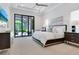 Spacious main bedroom with tray ceiling, and sliding glass doors to screened lanai at 4940 Peaceable Way, Sarasota, FL 34242