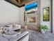 Inviting outdoor fireplace with cozy seating, perfect for relaxing evenings in the backyard at 4940 Peaceable Way, Sarasota, FL 34242