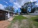 Spacious backyard with patio and partially fenced yard, offering plenty of room to enjoy at 503 Olive Ave, Nokomis, FL 34275