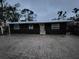 Charming home featuring simple architecture and a welcoming front door, enhanced by a paved driveway at 503 Olive Ave, Nokomis, FL 34275