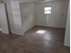 Bright room with a window and laminate flooring ready for new occupants at 503 Olive Ave, Nokomis, FL 34275