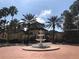 The property includes a well-maintained fountain with landscaping at 5701 Bentgrass Dr # 18-203, Sarasota, FL 34235
