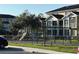 Community playground with slides and swings next to residential buildings and lush landscaping at 5701 Bentgrass Dr # 18-203, Sarasota, FL 34235