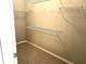 Spacious walk-in closet featuring ample shelving for organized storage solutions at 5701 Bentgrass Dr # 18-203, Sarasota, FL 34235