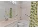 Bathroom featuring lemon themed shower curtain and linen closet at 5872 Mckinley Rd, Venice, FL 34293