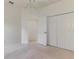 Bedroom featuring a ceiling fan, double door closet and an open doorway to the bathroom at 5872 Mckinley Rd, Venice, FL 34293