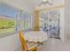 Breakfast nook with views of screened in lanai and manicured backyard at 5872 Mckinley Rd, Venice, FL 34293