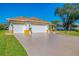Attractive single-story home featuring a three car garage, and well-manicured front yard at 5872 Mckinley Rd, Venice, FL 34293