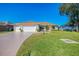 Lovely single-story home featuring a three car garage, and well-maintained lawn at 5872 Mckinley Rd, Venice, FL 34293