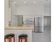 Open concept kitchen featuring a breakfast bar and stainless steel refrigerator at 5872 Mckinley Rd, Venice, FL 34293