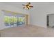 Spacious living area with sliding doors that open to an outdoor patio, offering seamless indoor-outdoor living at 5872 Mckinley Rd, Venice, FL 34293