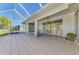 Spacious screened patio with tiled floors, fans and views to landscaped yard at 5872 Mckinley Rd, Venice, FL 34293