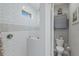 Modern bathroom featuring tiled shower with glass door, gray vanity and accents at 6 Bunker Cir, Rotonda West, FL 33947