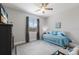 Neutral painted bedroom with wood-look flooring, a ceiling fan, and a picturesque view at 6 Bunker Cir, Rotonda West, FL 33947