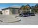 Charming clubhouse with golf carts parked outside, offering convenience and a welcoming atmosphere at 6 Bunker Cir, Rotonda West, FL 33947