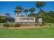Rotonda West deed restricted community entrance sign with manicured landscaping at 6 Bunker Cir, Rotonda West, FL 33947