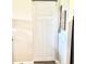 Hallway featuring a white sliding barn door and neutral paint at 6 Bunker Cir, Rotonda West, FL 33947