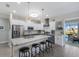 Stylish kitchen with stainless steel appliances, granite countertops, and white and gray cabinetry at 6 Bunker Cir, Rotonda West, FL 33947
