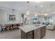 Open-concept kitchen flows into dining and living areas, great for gatherings and entertaining guests at 6 Bunker Cir, Rotonda West, FL 33947