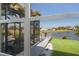 The lanai offers a scenic view of the lake, palm trees, and golf course at 6 Bunker Cir, Rotonda West, FL 33947