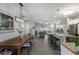 Bright, open-concept living space connecting dining, kitchen and living room; ideal for entertaining at 6 Bunker Cir, Rotonda West, FL 33947