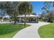 Open-air pavilion with picnic tables and lush green surroundings at 6 Bunker Cir, Rotonda West, FL 33947