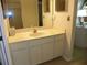 Bathroom vanity with cabinets, a mirror, and recessed lighting at 6042 Red Maple Rd # 1001, Bradenton, FL 34210