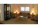 Cozy living room with floral armchairs, sofa, and decorative lighting for comfortable living at 6042 Red Maple Rd # 1001, Bradenton, FL 34210