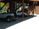 Covered parking area showcasing golf carts and equipment for community recreational use at 6042 Red Maple Rd # 1001, Bradenton, FL 34210