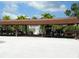 Covered parking area for golf carts with a glimpse of the pool area in the background at 6042 Red Maple Rd # 1001, Bradenton, FL 34210