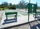Outdoor shuffleboard courts with benches, surrounded by lush landscaping for a relaxing recreation at 6042 Red Maple Rd # 1001, Bradenton, FL 34210