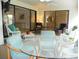 Relaxing sunroom with dining and living areas, enhanced by natural light and neutral colors at 6042 Red Maple Rd # 1001, Bradenton, FL 34210